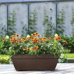 Southern Patio Newbury 27" Dia. Cocoa Plastic Deck Box Planter -Achla Designs Shop cocoa southern patio plant pots nq2710co a0 1000