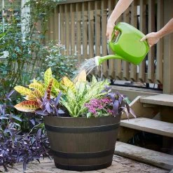 Southern Patio 22.44 in. Dia x 14.96 in. H Rustic Oak High-Density Resin Whiskey Barrel Planter 16 Southern Patio 22.44 in. Dia x 14.96 in. H Rustic Oak High-Density Resin Whiskey Barrel Planter -Achla Designs Shop dark brown southern patio barrel planters hdr 023395 c3 1000