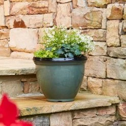 Southern Patio Heritage Large 18 in. x 14.4 in. Green High-Density Resin Planter 14 Southern Patio Heritage Large 18 in. x 14.4 in. Green High-Density Resin Planter -Achla Designs Shop green southern patio plant pots hdr 077046a a0 1000