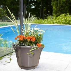 Southern Patio Westbourne Flange Large 22 in. x 15.75 in. Saddle Brown High-Density Resin Planter -Achla Designs Shop saddle southern patio plant pots hdr 020905 33 fa 1000